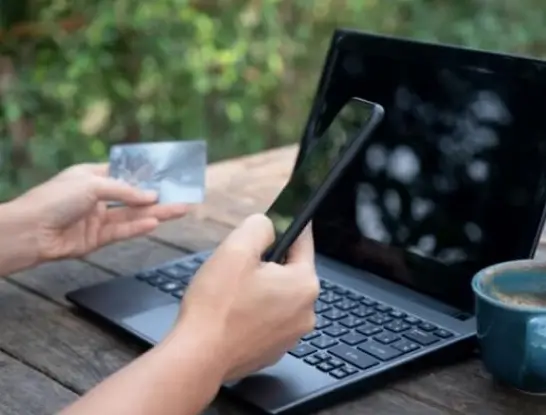 A person using laptop who is facing fraud charges